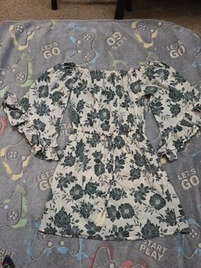 Off-Shoulder White Mini Dress with Black Floral Pattern
